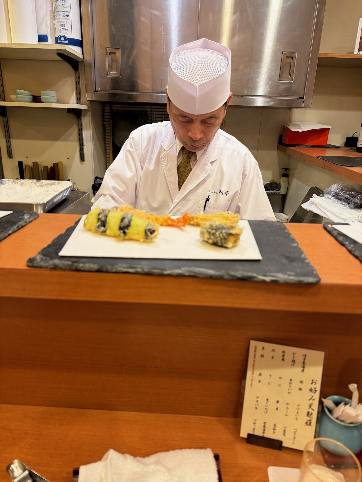 Chef frying tempura at a Tokyo counter
