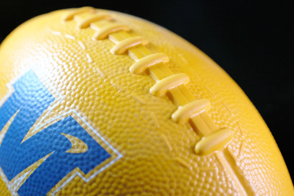 McLaren F1 Team promo foam football, yellow with the blue McLaren logo, close-up of the laces