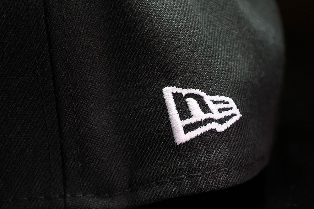 New Era side logo on the Undefeated x New Era Icon Fitted cap, black Tokyo colorway with Japan flag